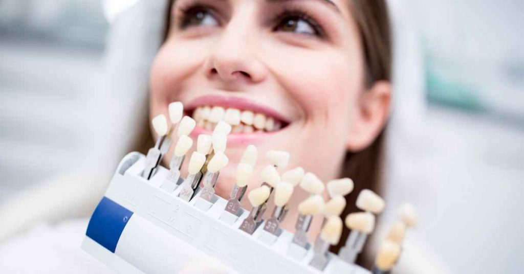 A woman and different types of veneers