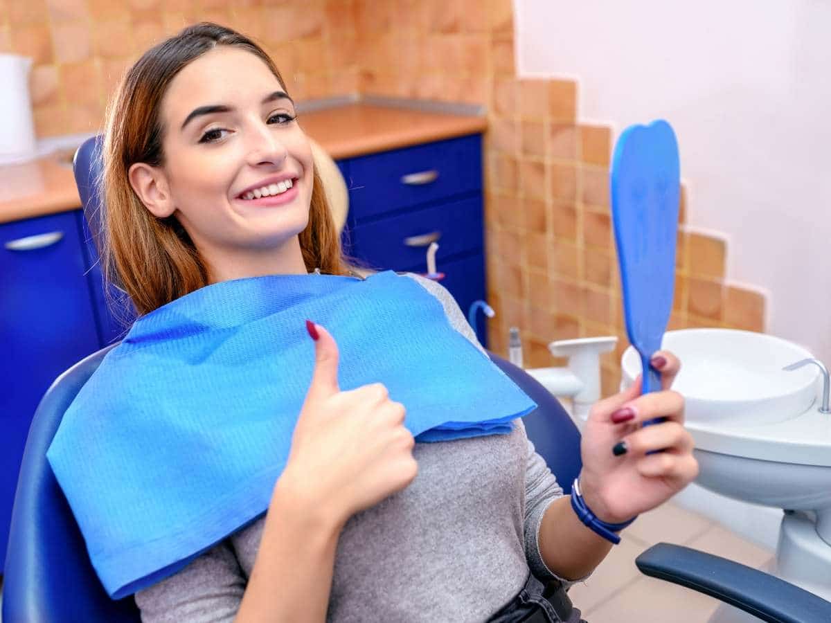 Happy woman before having wisdom teeth removal
