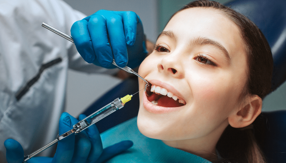 Young girl looking relaxed while having a dental injection