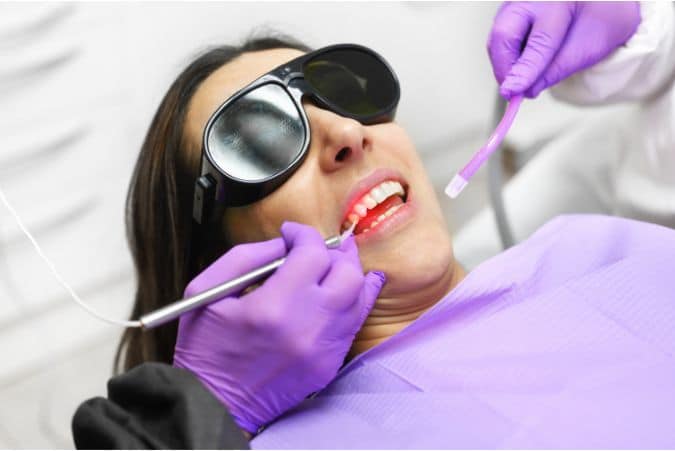 Laser being used by a dentist