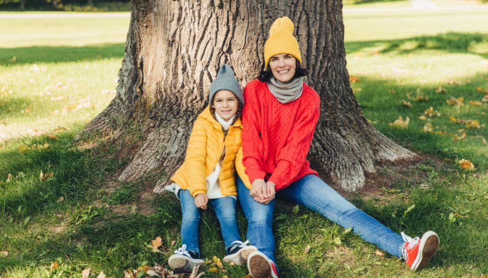 Family smiling in cold weather